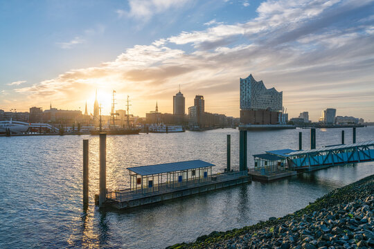Port of Hamburg at sunrise with view of Elbphilharmonie concert hall