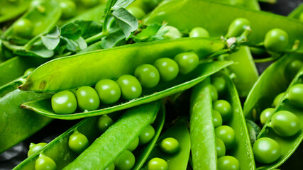 young green peas, macro photo. Top view. Green style.