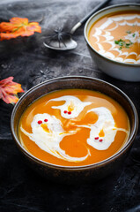 Pumpkin Soup, Halloween Cream Soup on Dark Cobweb Background