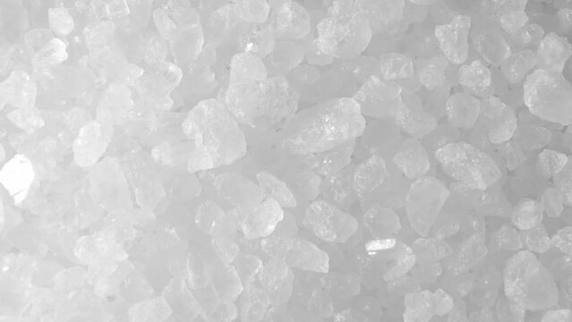 Himalayan fine white salt up close in this mesmerizing macro video. Watch as the delicate crystals shimmer and reflect light, revealing nature's purest essence.
