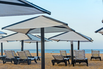 Sunbeds, Beach loungers, Relaxation, Beachside, Umbrellas,
