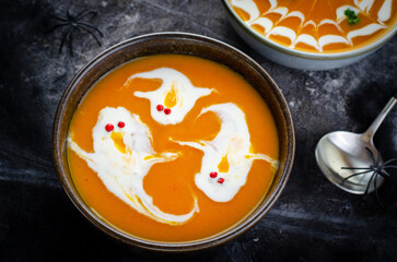 Pumpkin Soup, Halloween Cream Soup on Dark Cobweb Background
