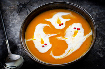 Pumpkin Soup, Halloween Cream Soup on Dark Cobweb Background