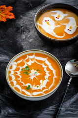 Pumpkin Soup, Halloween Cream Soup on Dark Cobweb Background