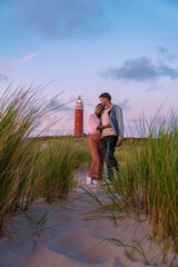 Texel lighthouse during sunset Netherlands Dutch Island Texel Holland, the couple visit the...