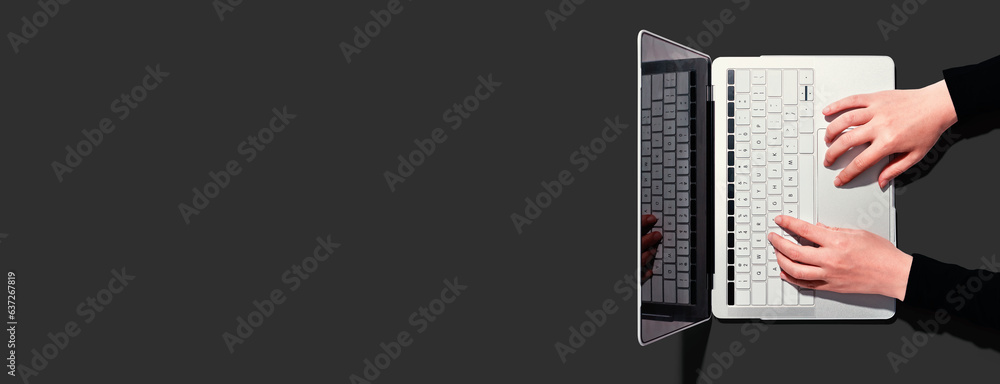 Poster person using a laptop computer from above