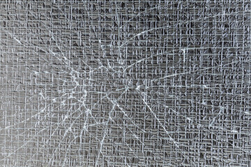 Broken laminated safety glass background and texture