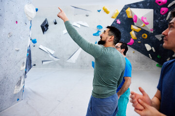 Men climbing in a bouldering gym
