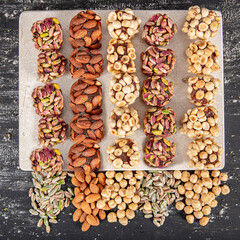 Turkish Dessert Cezerye with Hazelnut, Almond or pistachio. Turkish delight with carrot nuts atom...