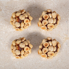 Turkish Dessert Cezerye with Hazelnut, Almond or pistachio. Turkish delight with carrot nuts atom...