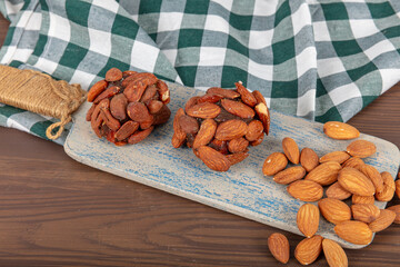 Turkish Dessert Cezerye with Hazelnut, Almond or pistachio. Turkish delight with carrot nuts atom...