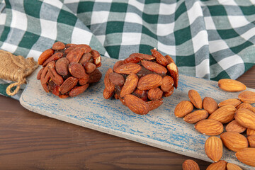 Turkish Dessert Cezerye with Hazelnut, Almond or pistachio. Turkish delight with carrot nuts atom...