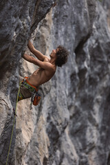 rock climber climbs the rock.