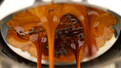 Pouring coffee espresso stream through Bottomless Portafilter