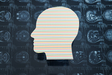 Images of MRI or magnetic resonance imaging with a paper human head.