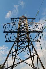 High Voltage Power Line Tower on the Blue Sky Background