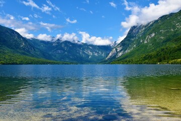 Scenic view of Bohinj lake in summer and mountain above in Julian alps, Gorenjska, Slovenia