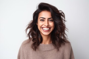 Obraz premium Medium shot portrait of an Indian woman in her 30s against a white background