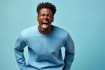Anger African Man In A Blue Jeans On Pastel Background. Culture Identity African Man, Emotion Anger, Fashion Blue Jeans, Art Pastel Background