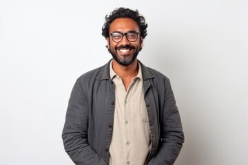 Obraz premium Medium shot portrait of an Indian man in his 30s against a white background