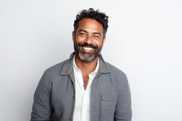 Obraz premium Medium shot portrait of an Indian man in his 30s against a white background