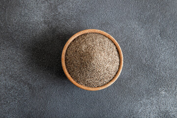 Powder black pepper on black background,top view
