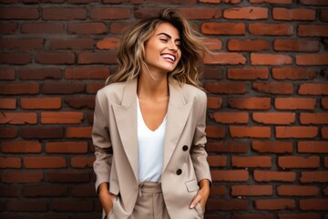 Fototapeta na wymiar Happiness Woman In A Beige Suit On Brick Wall Background. Сoncept Happiness For Women In Professional Settings, Feeling Confident In Beige Suits, Power Of Visualization With Backgrounds