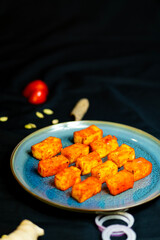 Delicious and colorful Indian food on a black background