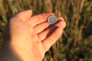 Small Czech coin in hand - obrazy, fototapety, plakaty