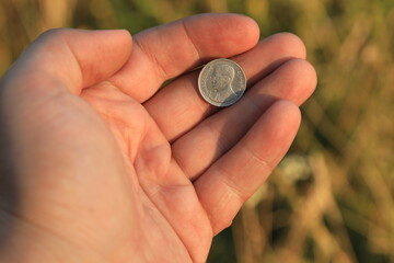 Small Georgian coin in hand