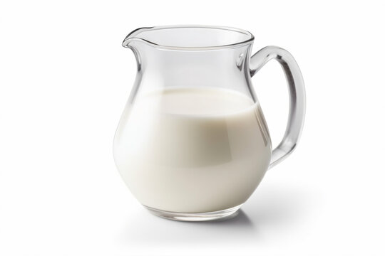 a pitcher of milk on a white surface