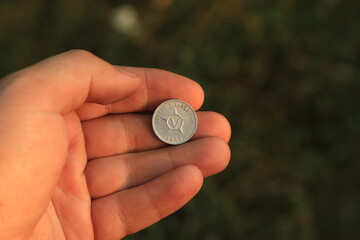 Old Cuban coin in hand