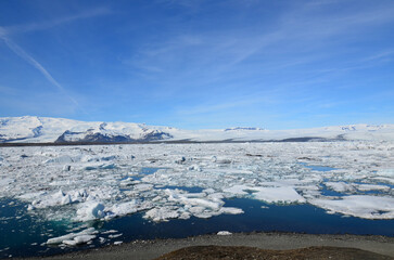 Snow and Ice Surrounding a Melting Blue Lagoon
