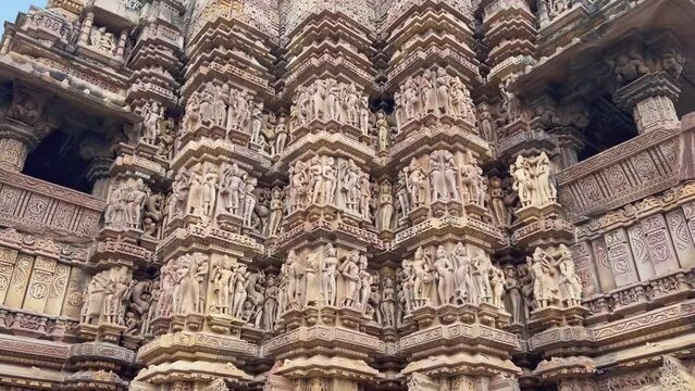 Erotic sculptures or architecture at the outside or exterior temple, within the Khajuraho Western Group of Monuments in the Chhatarpur district, Madhya Pradesh, India, Asia