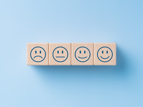 Wooden Cubes With Happy Normal And Sad Face Icons For Experience Survey Services And Products Review Concept. Customer Service Rating Experience. Client Satisfaction, Positive Or Negative Feedback