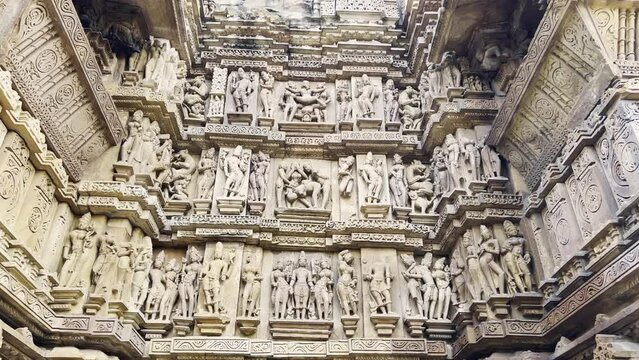 Erotic sculptures or architecture at the outside or exterior temple, within the Khajuraho Western Group of Monuments in the Chhatarpur district, Madhya Pradesh, India, Asia