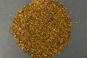 dry seasoning for soup and different dishes on a gray background