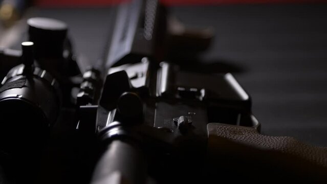 AP-15 close-up, lying on a table with a telescopic sight