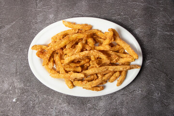 French Fries and potato chips served in dish isolated on background top view of bangladesh food