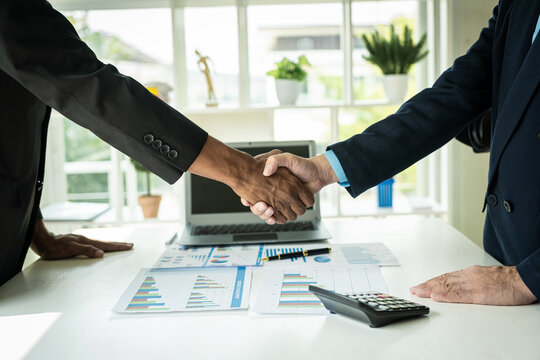 Businessman shaking hands with partners greeting, deal merger, business venture concept, investment, teamwork and successful business. remote picture