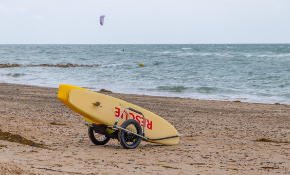 rescue board on a beach from lifeguard