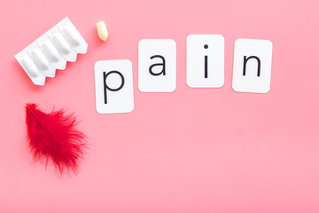 Pharmacy concept. Word pain with red pen and rectal suppositories