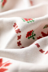 White linen cloth with traditional folk motifs