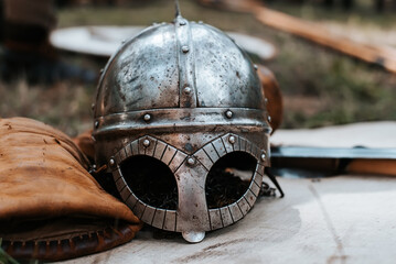 Close-up of medieval old iron warrior helmet, ancient viking equipment outdoors