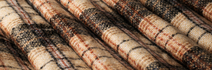 Soft checkered woolen cloth, fashion industry, cozy blanket in warm tones - 637364462