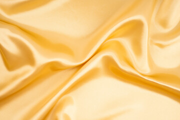 The Golden color silk texture background.