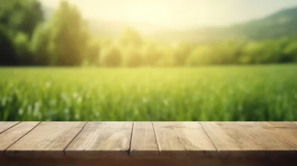 Fototapete Pistache Wooden table top on blurred background of green field and blue sky