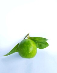 lime with leaves on white background
