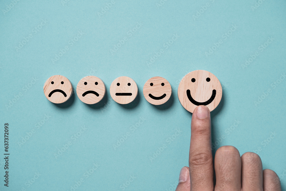 Poster hand touching to smile face on blue background for positive thinking and excellent evaluation after 