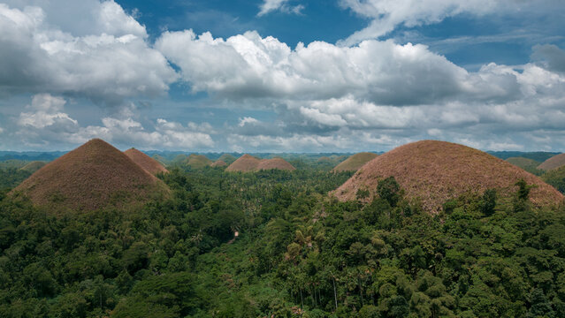 Photograph of the Chocolate Hills mountains in Bohol in the Philippines. Landscape in Asia. Wallpaper. Aerial photography. Image for travel agency